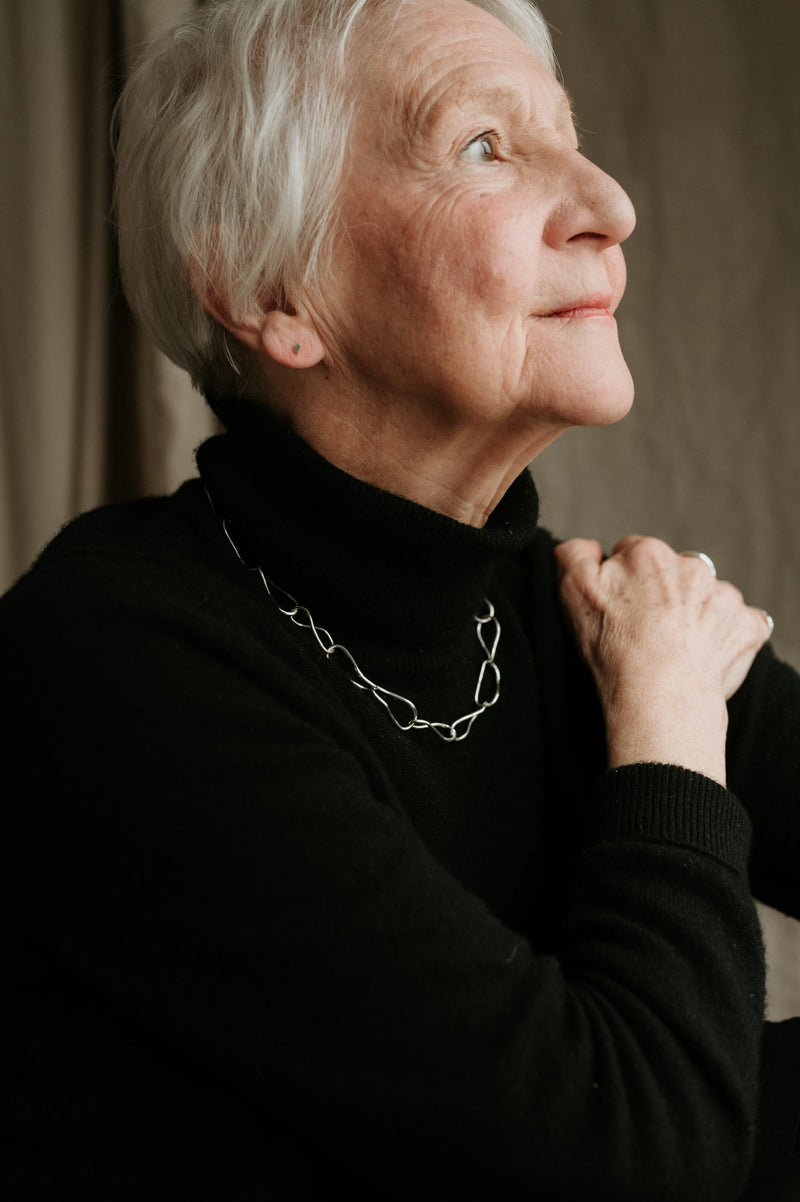 mature lady wearing handcrafted silver chain | Studio Adorn handmade jewellery | sustainable jewellery