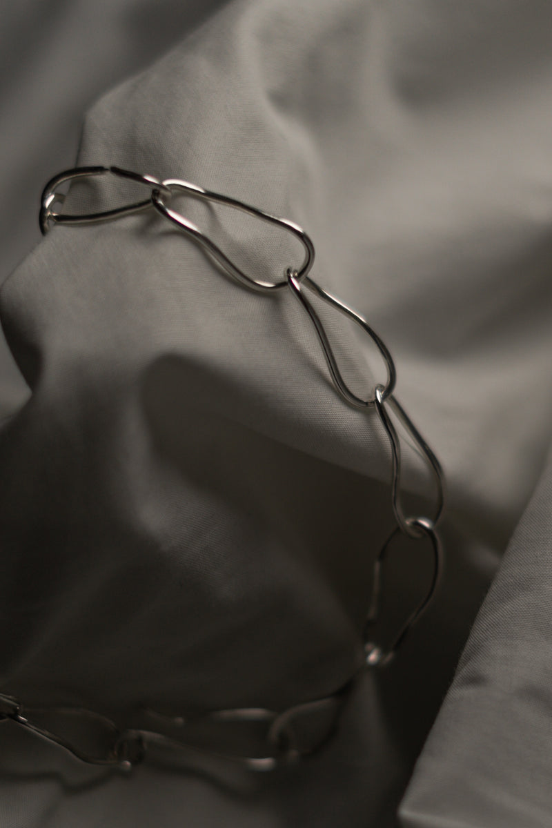 modern silver chain on a grey background