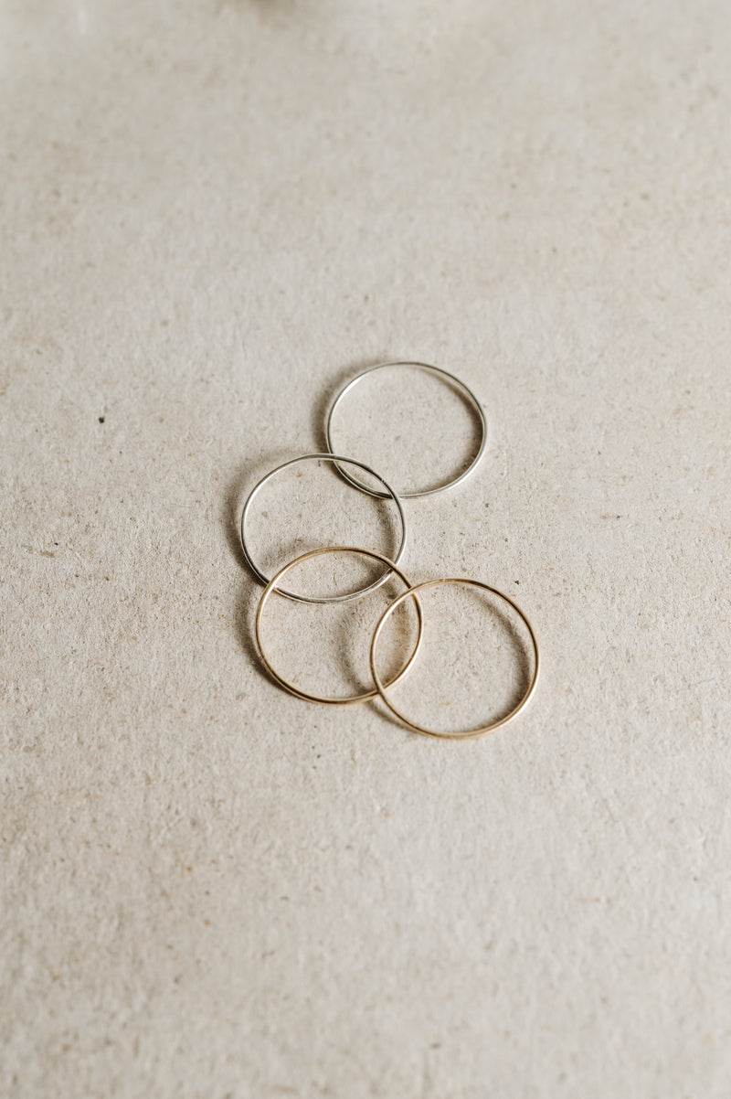 four stacking rings laid on a concrete background