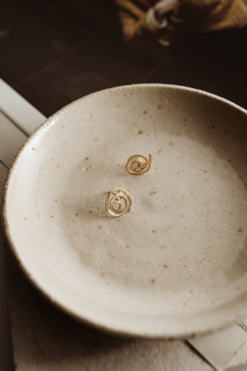 Unique pair of spiral stud earrings handcrafted from solid 9ct gold