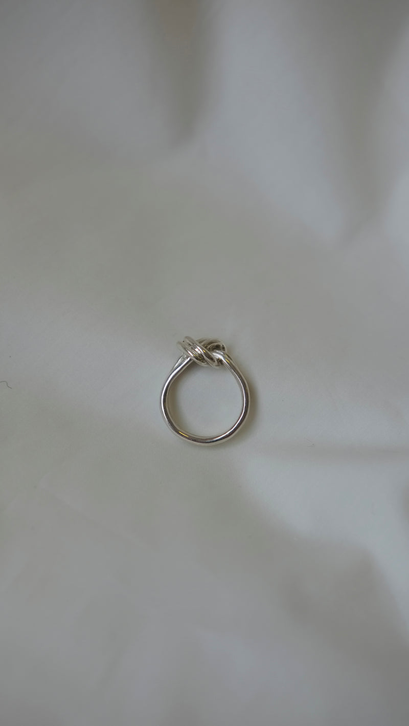 Double Knot Statement Ring made from recycled silver on a white background - Studio Adorn Jewellery Norwich
