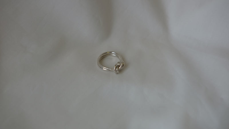 Double Knot Ring made from recycled silver on a wite background - Studio Adorn Jewellery Norwich