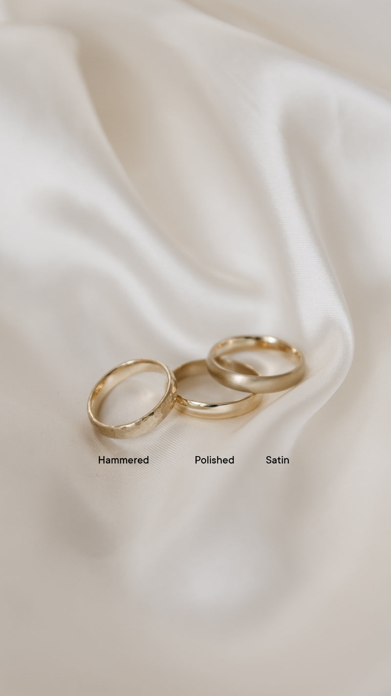 three minimal gold rings showing hammered, satin, and polished finishes