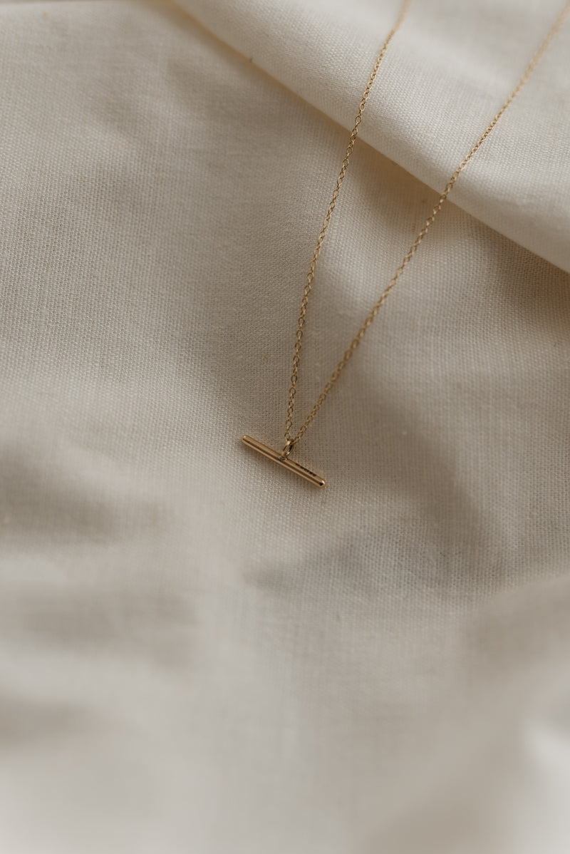 Studio Adorn polished 9ct recycled gold minimal bar necklace on a gold trace chain