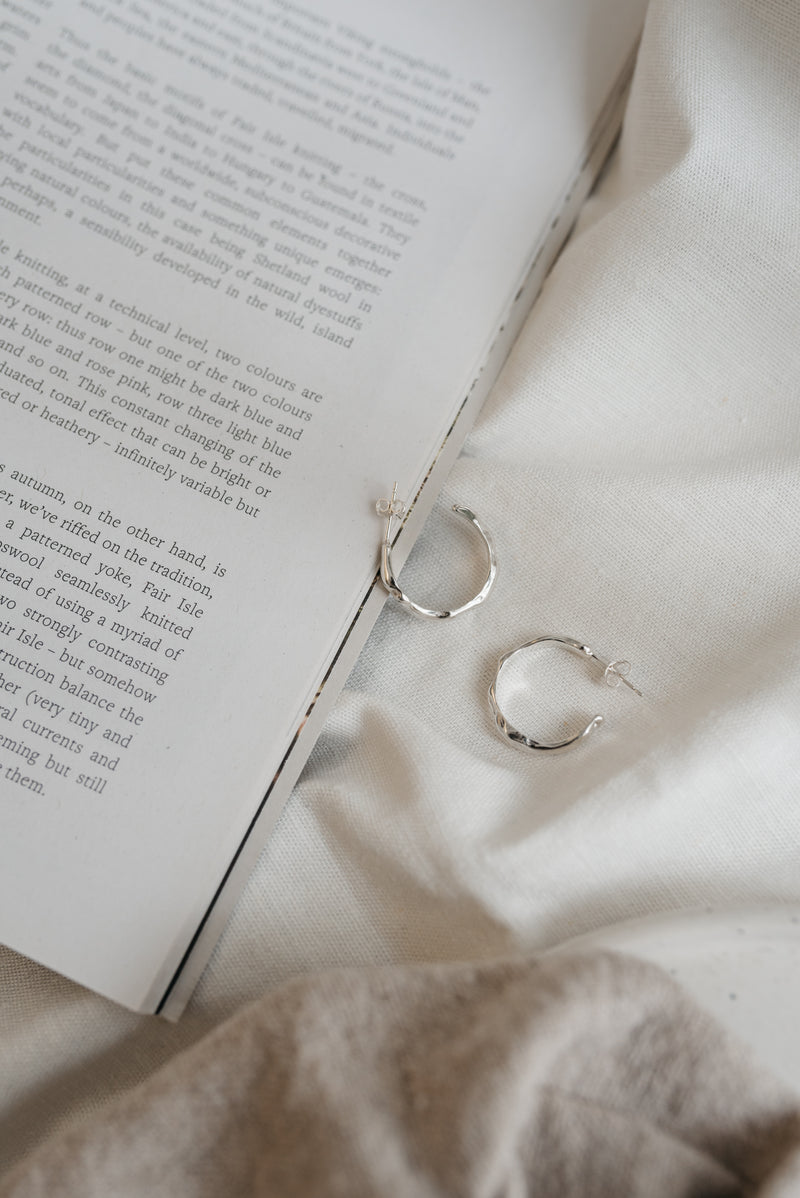 Silver melty open hoop earrings handmade by Studio Adorn
