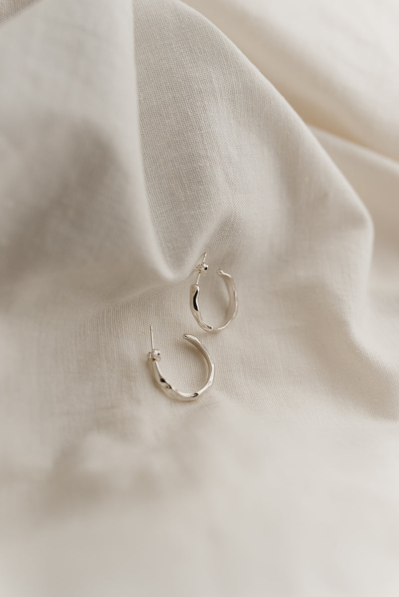 Silver melty open hoop earrings handmade by Studio Adorn