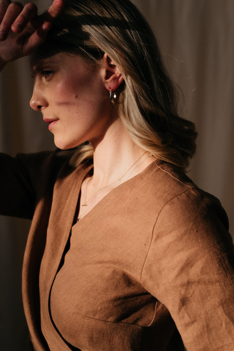 Model wearing Silver melty open hoop earrings handmade by Studio Adorn