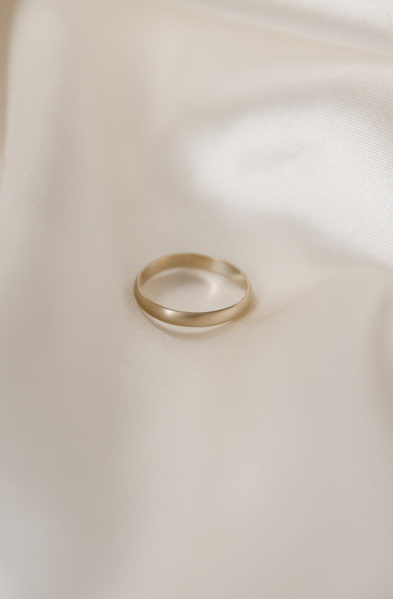 3mm D-shaped wedding ring handmade from recycled 9ct gold with satin finish on a white background
