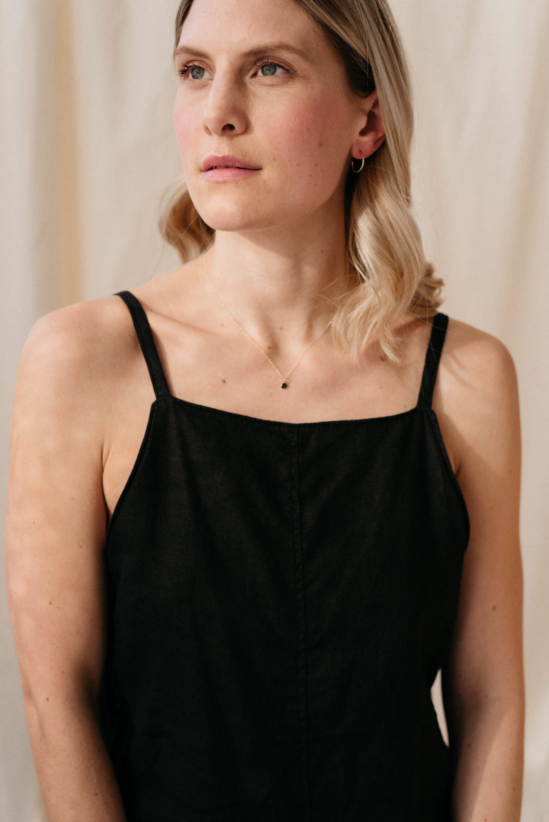 Studio Adorn front profile of model wearing recycled gold zero waste pebble necklace on fine curb chain