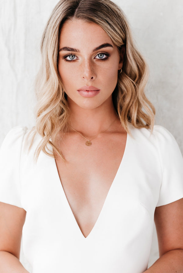 Studio Adorn front profile of model wearing delicate hammered gold disc necklace | handmade jewellery