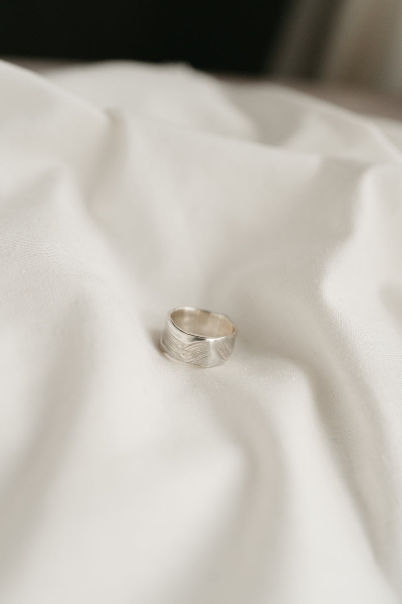 handmade sterling silver ring on a white background