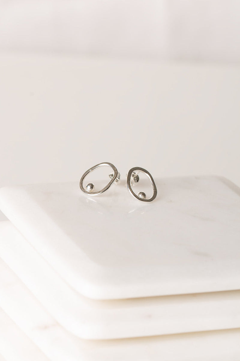 Open circle silver stud earrings handmade by Studio Adorn