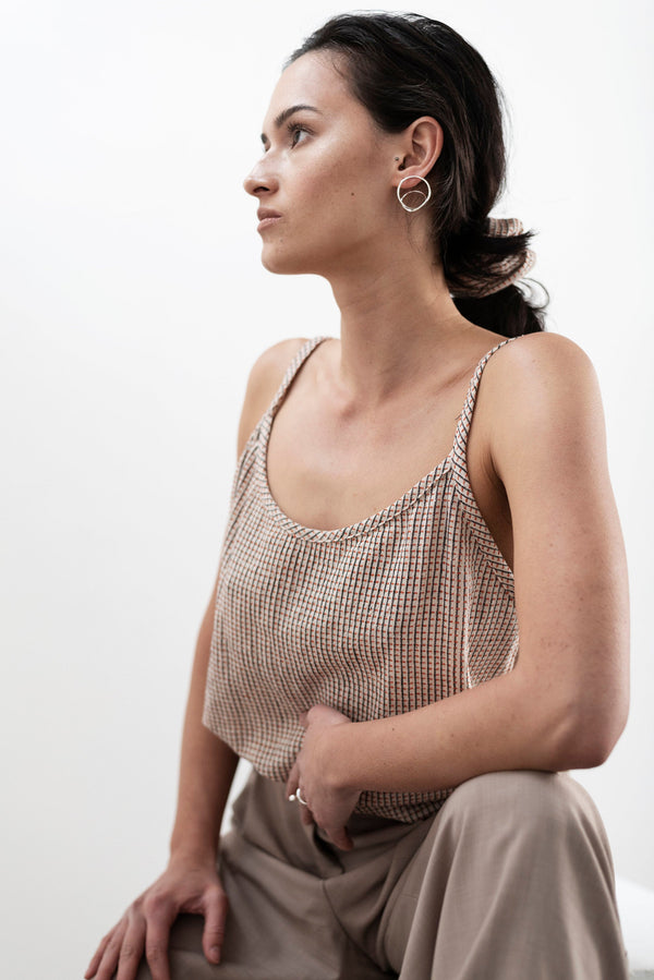 Model wearing statement silver hoop earrings handmade by Studio Adorn