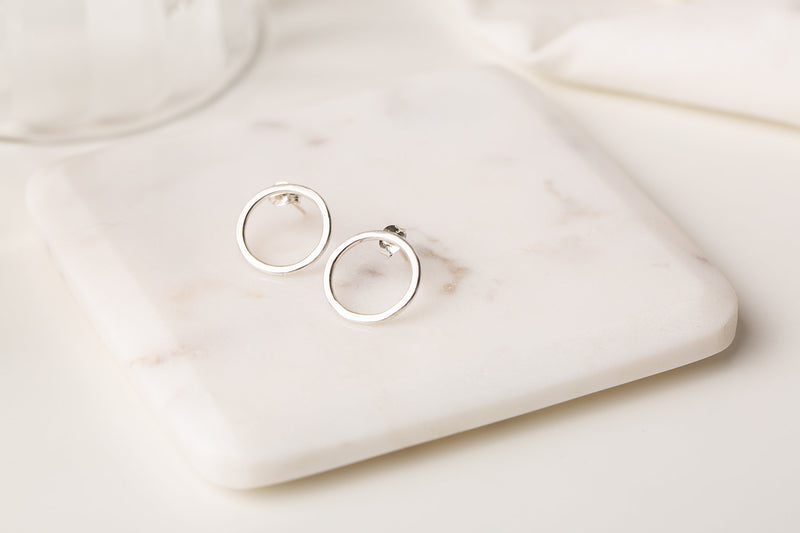 Simple round silver stud earrings handmade by Studio Adorn