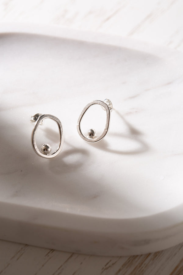 Open circle silver stud earrings handmade by Studio Adorn