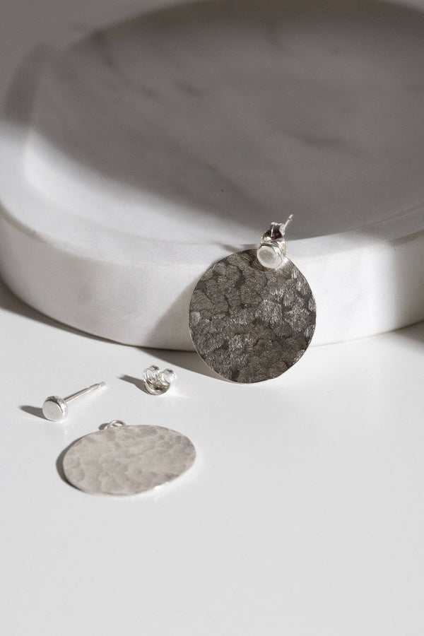 Silver hammered disc ear jacket earrings handmade by Studio Adorn  Edit alt text