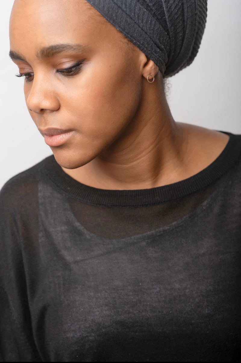 Studio Adorn side profile of model wearing gold circle earrings 