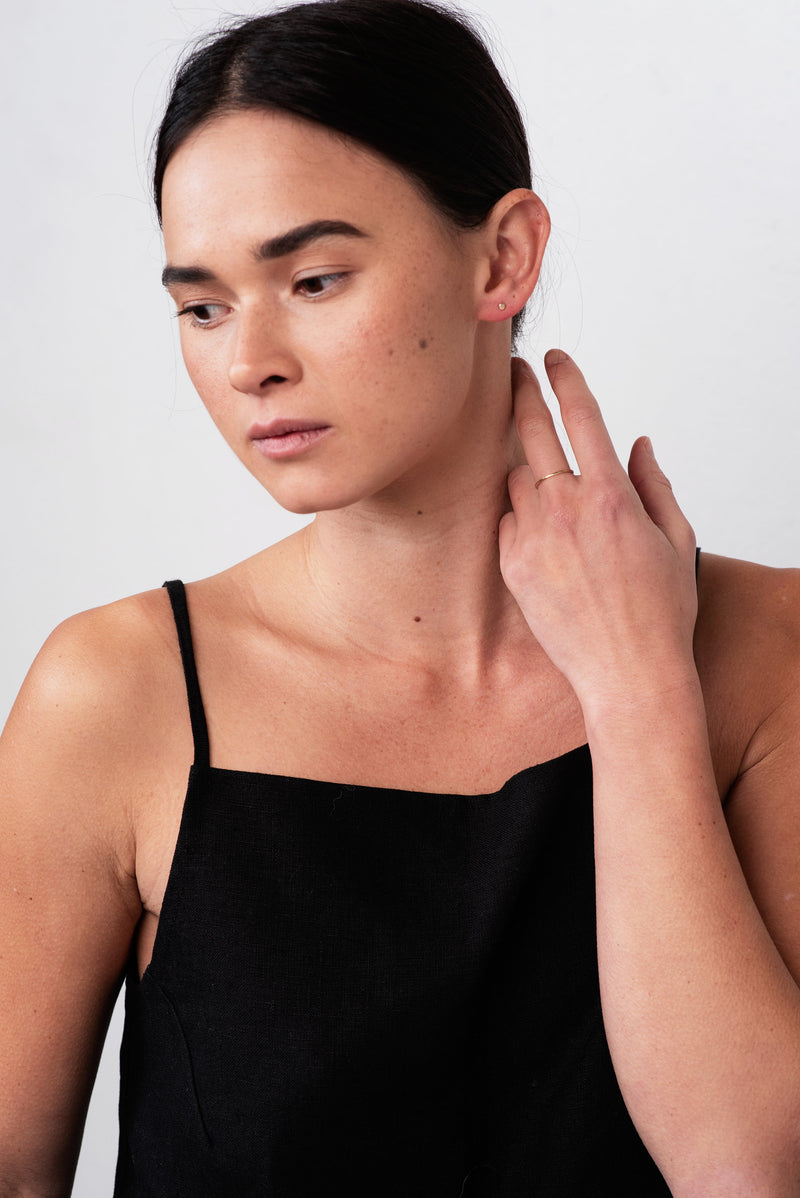 Studio Adorn front profile of model wearing mini 9 carat recycled gold zero waste earrings 