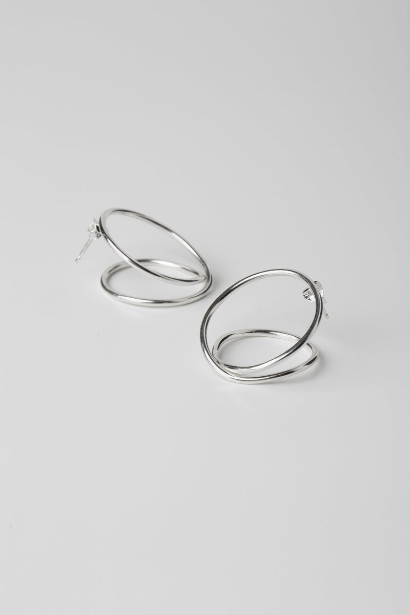 Statement silver hoop earrings handmade by Studio Adorn