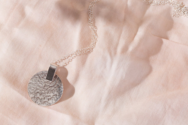 Silver disc necklace handmade by Studio Adorn