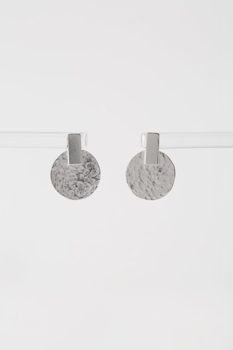 Silver hammered disc stud earrings handmade by Studio Adorn