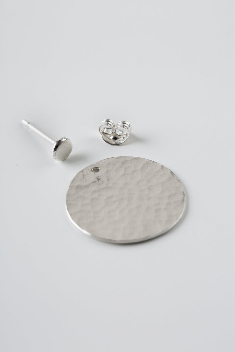 Silver hammered disc ear jacket earrings handmade by Studio Adorn  Edit alt text