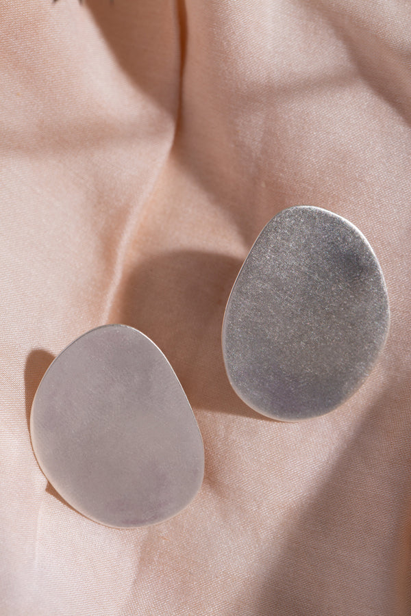 Statement organic shape silver stud earrings handmade by Studio Adorn