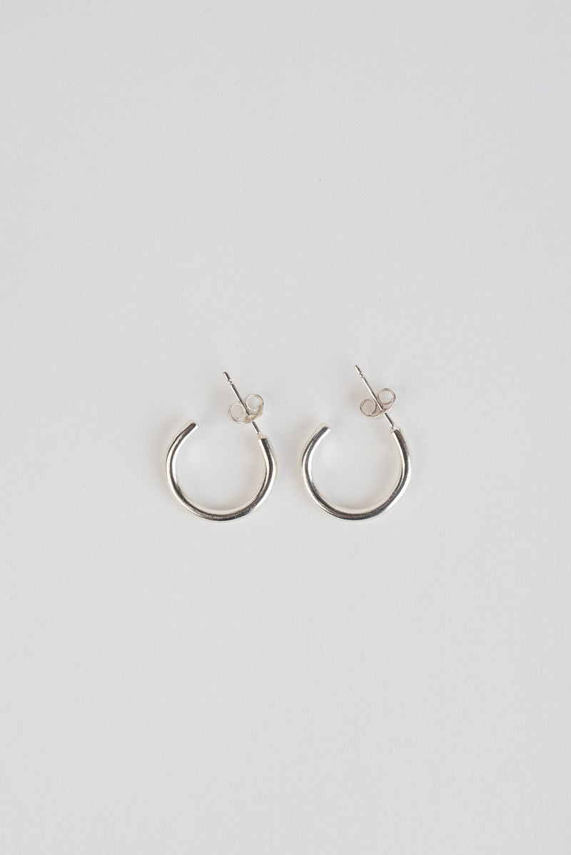 Simple silver minimal hoop earrings handmade by Studio Adorn