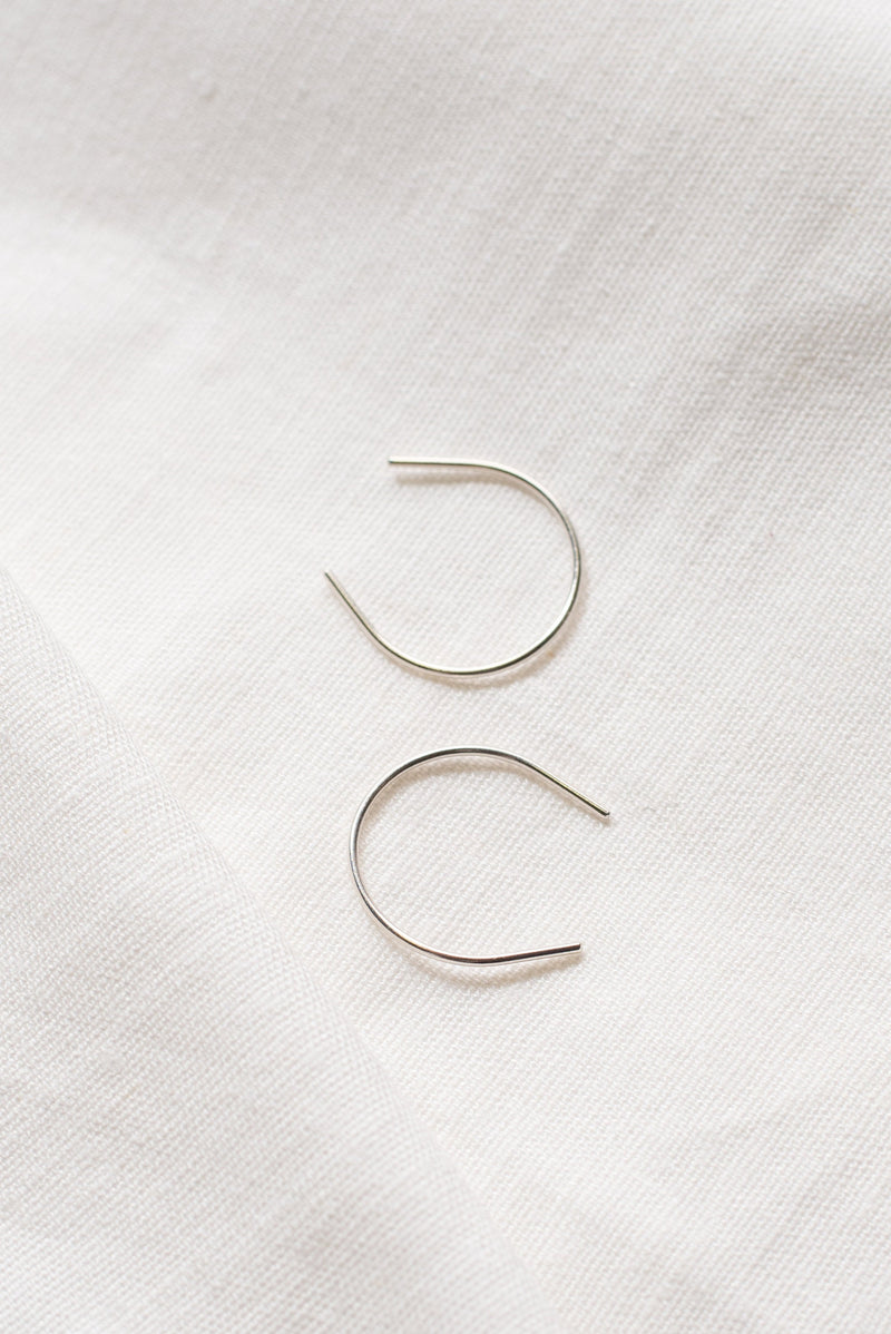 Silver curve ear pin threads handmade by Studio Adorn