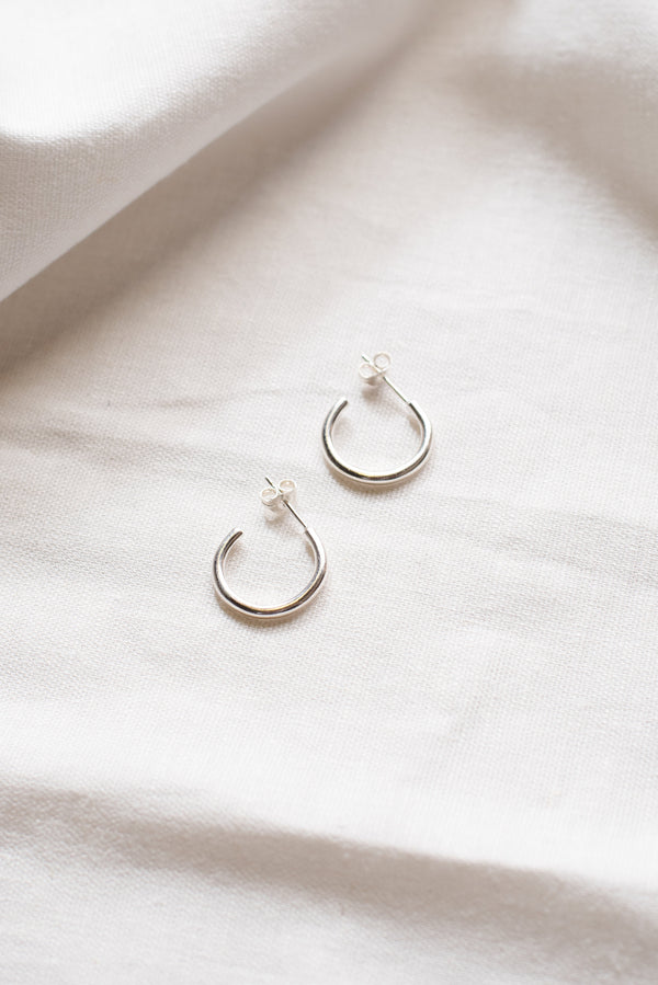 Simple silver minimal hoop earrings handmade by Studio Adorn