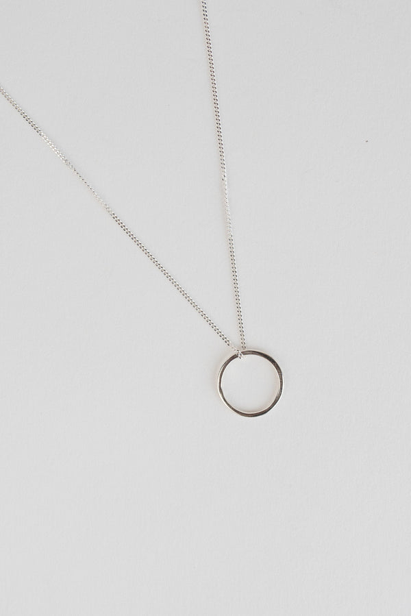 Mini circle silver pendant necklace handmade by Studio Adorn