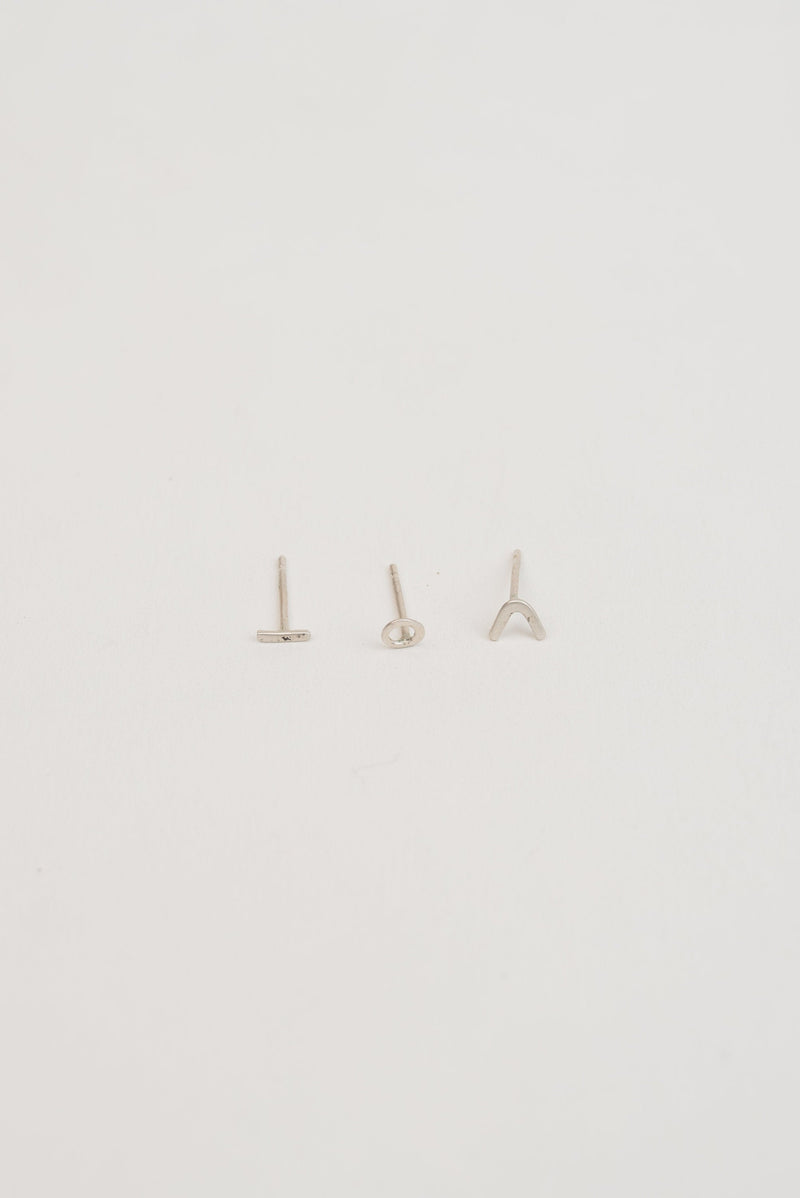 Trio of mini silver stud earrings handmade by Studio Adorn