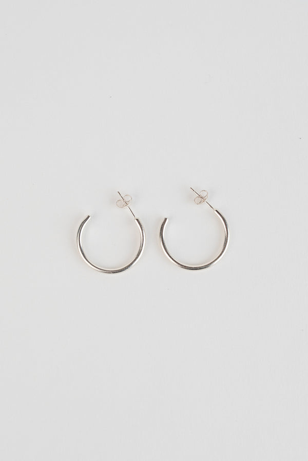 Large silver minimal hoop earrings handmade by Studio Adorn