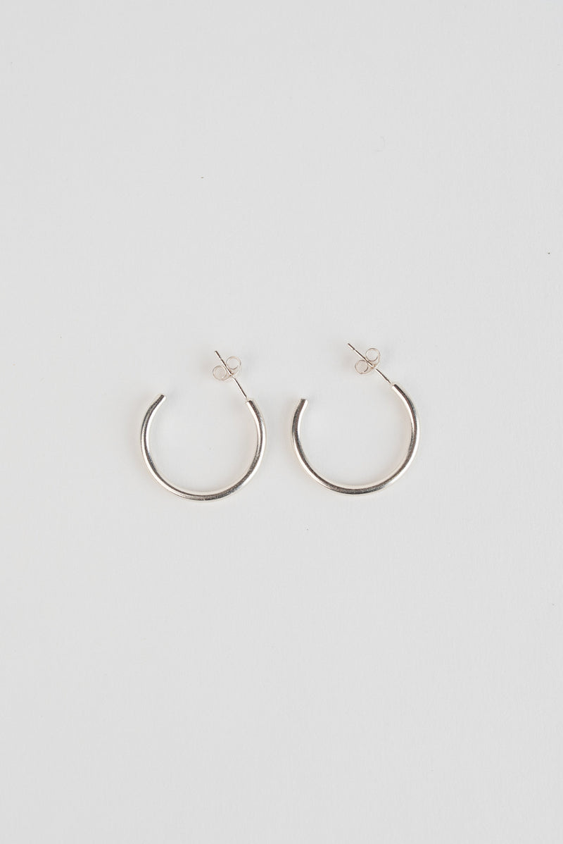 Large silver minimal hoop earrings handmade by Studio Adorn