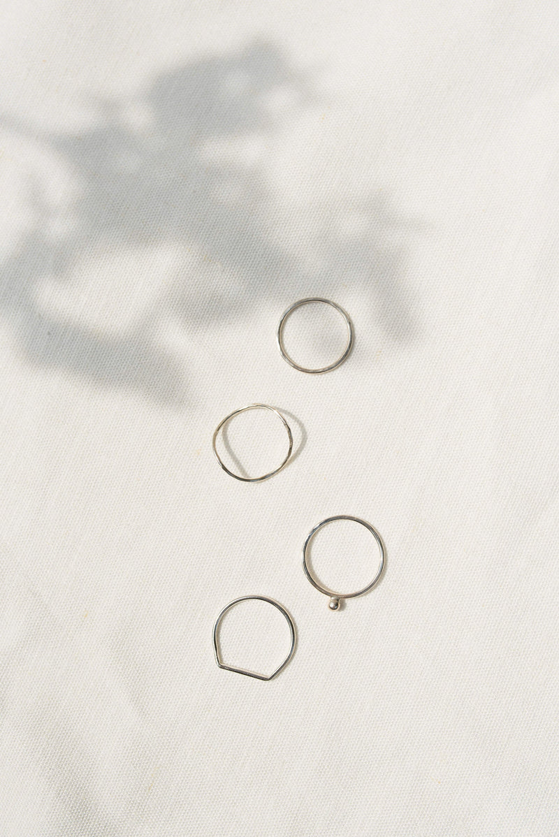 Plain hammered stacking rings in silver handcrafted by Studio Adorn