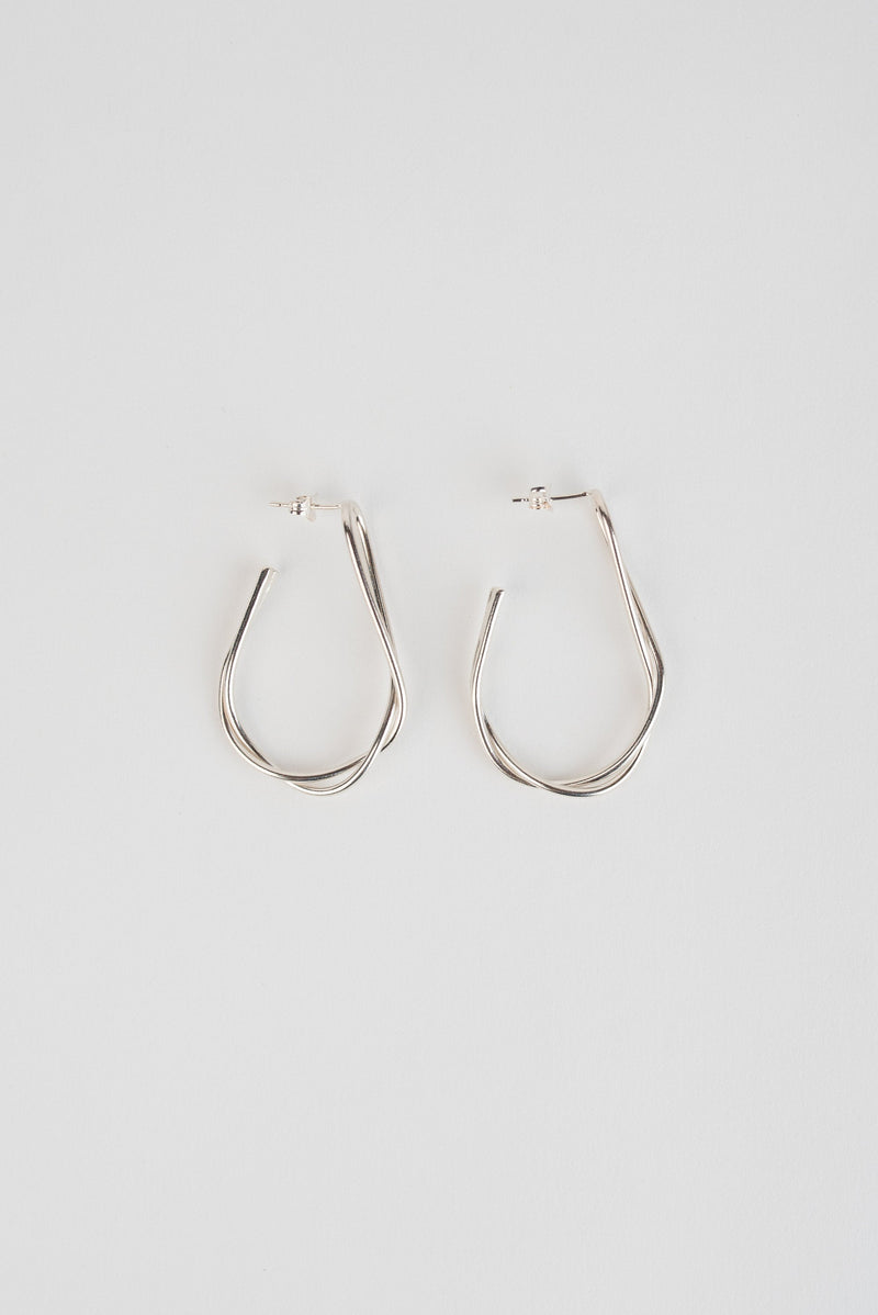 Statement silver twist hoop earrings handmade by Studio Adorn