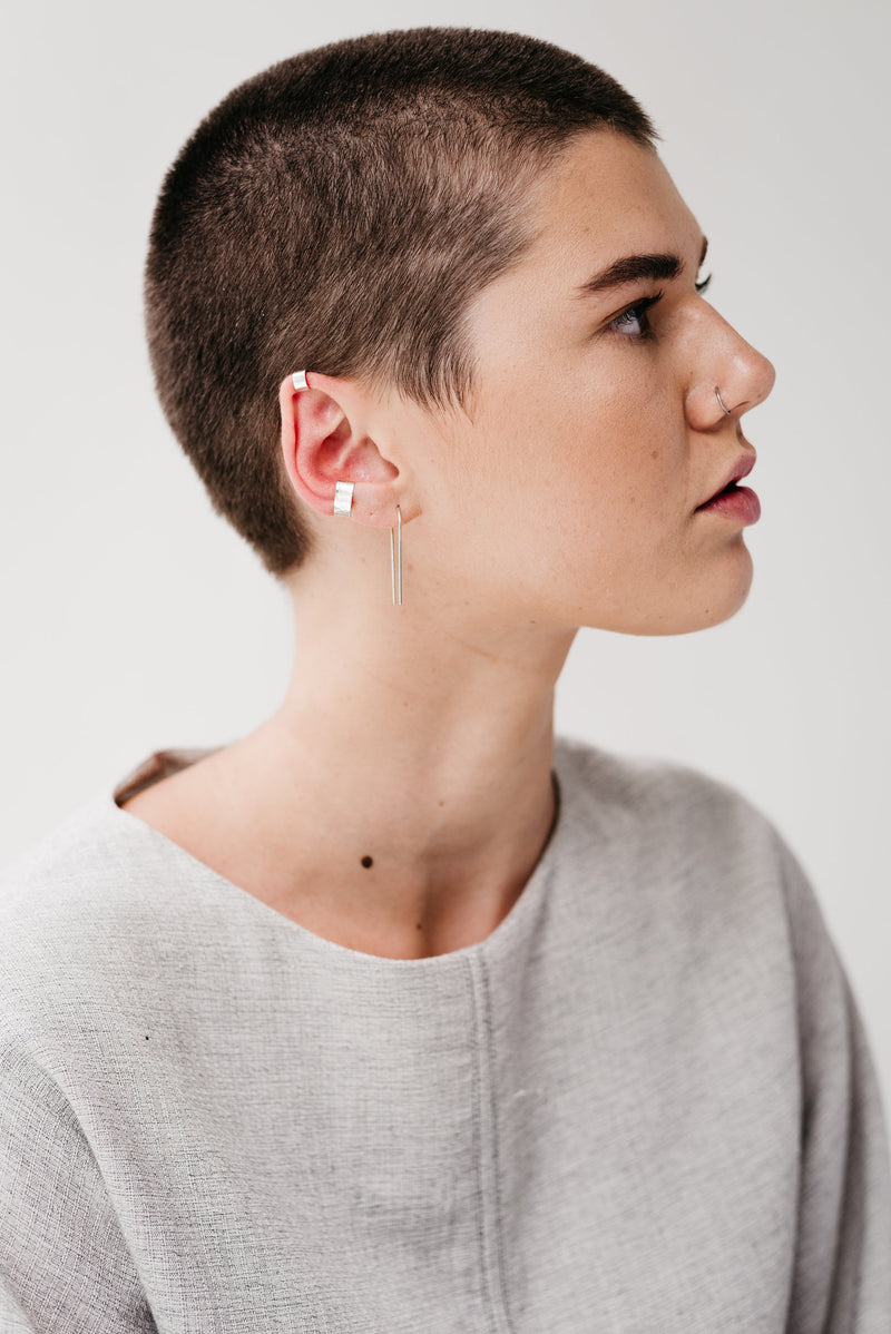 Model wearing silver ear cuff earring handmade by Studio Adorn