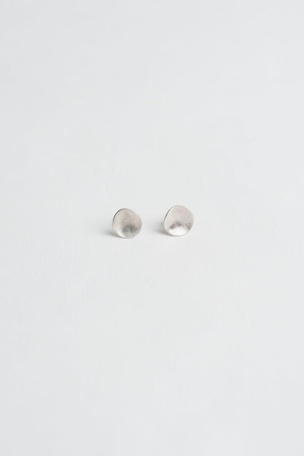Mini molten silver stud earrings handmade by Studio Adorn