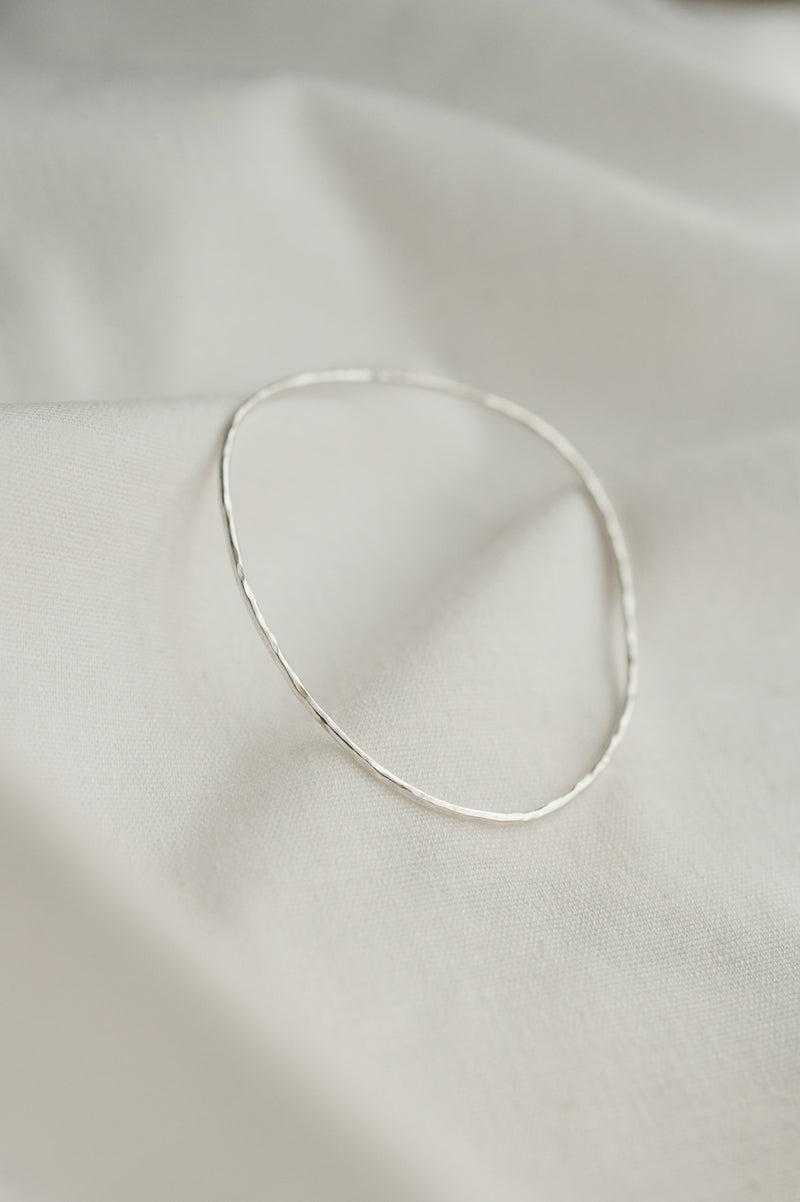 Hammered Organic Shaped Bangle made by Studio Adorn Jewellery from Recycled Silver
