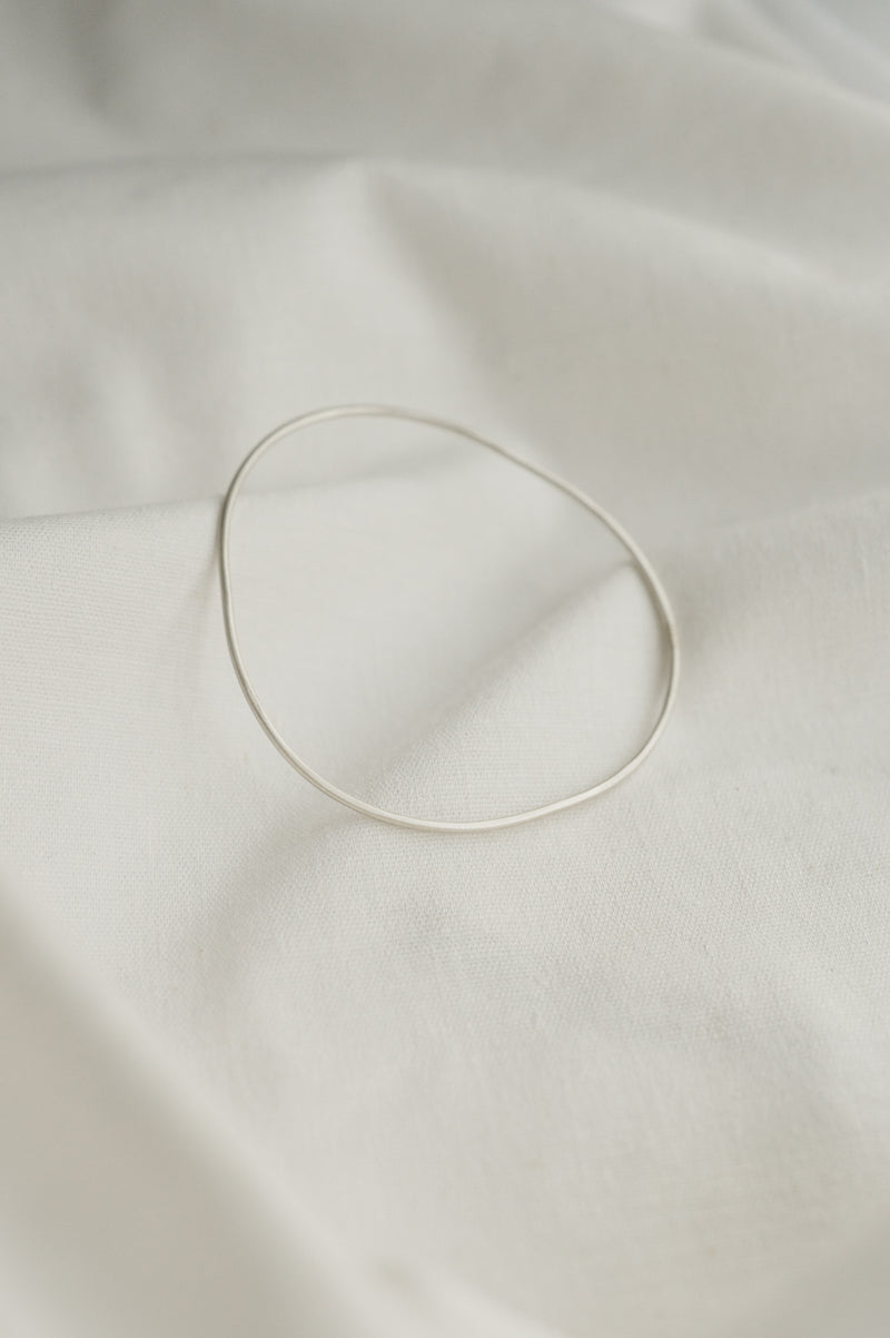 Trio Of Organic Skinny Shaped Bangles made by Studio Adorn Jewellery from Recycled Eco Silver