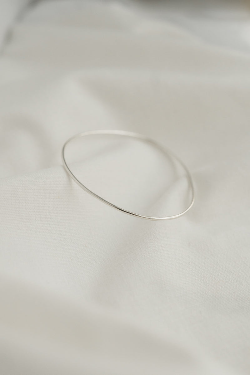 Polished Organic Shaped Bangle made by Studio Adorn Jewellery from Recycled Silver