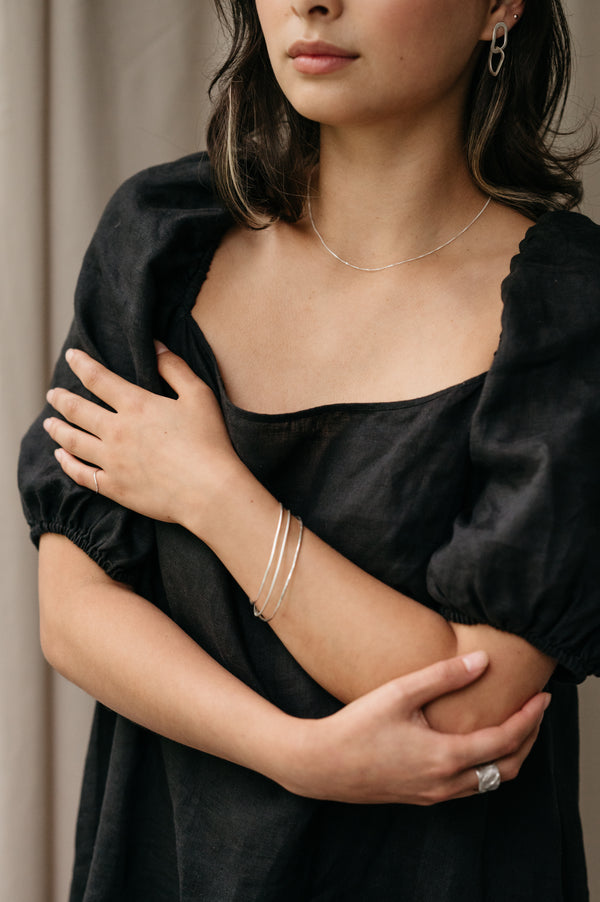 Trio Of Organic Skinny Shaped Bangles made by Studio Adorn Jewellery from Recycled Eco Silver