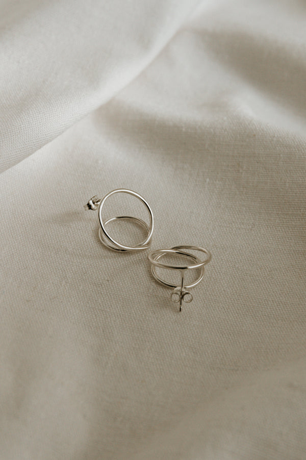 Studio Adorn Jewellery - Mini Twist Hoop Earrings on a pale background
