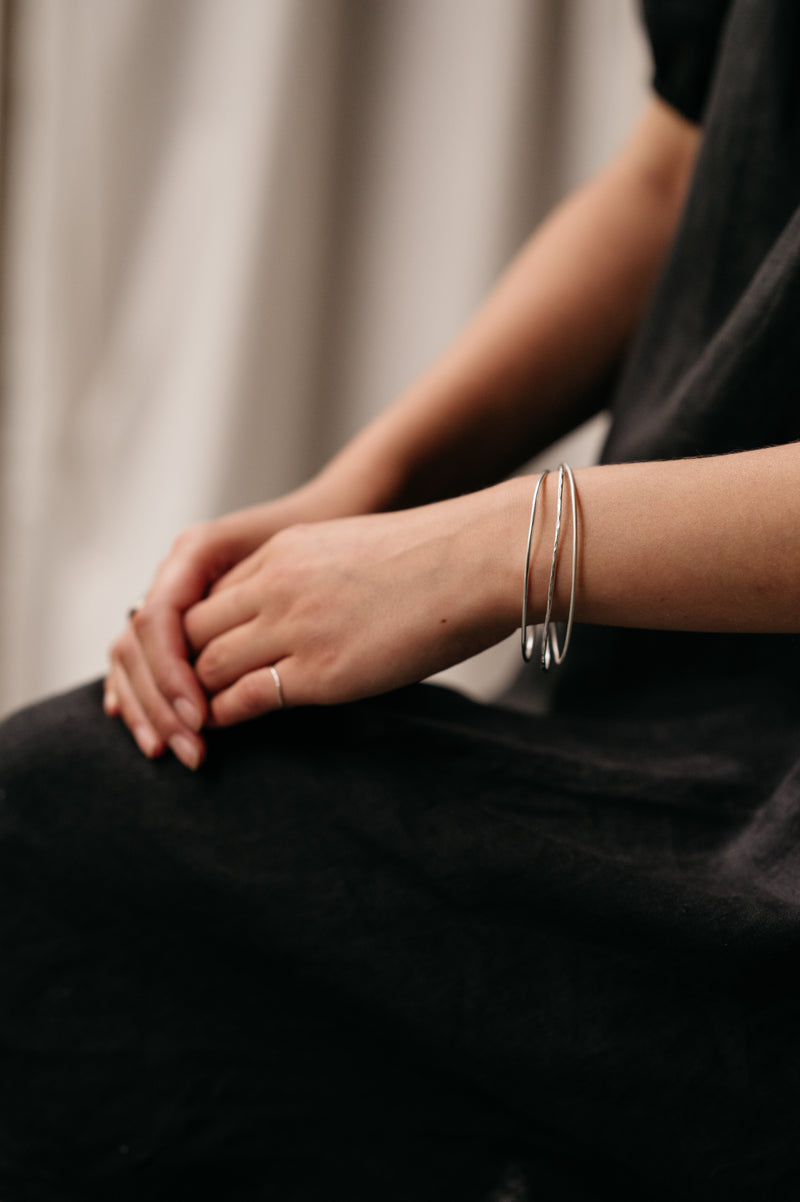 Organic Shaped Bangles made by Studio Adorn Jewellery from Recycled Silver