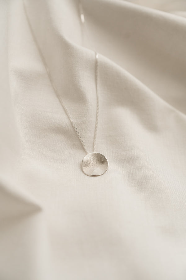 Handmade Mini Moon Pendant made from sustainable recycled sterling silver by Studio Adorn Jewellery